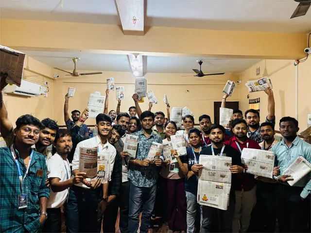 A group pictured holding newspapers in The Drop Organization’s official gallery